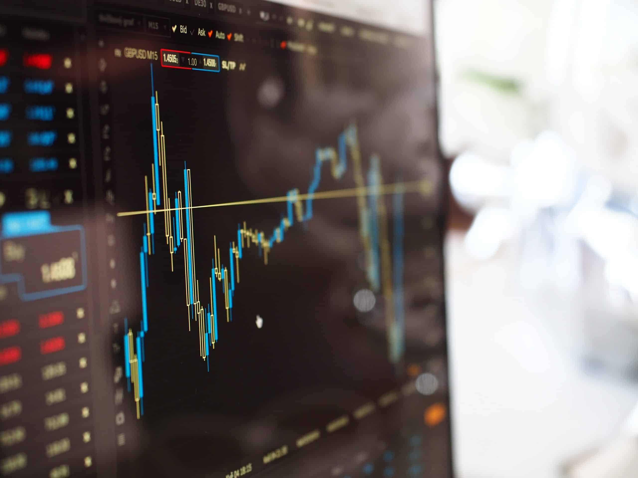 image of a coputer screen with stock market graph and data