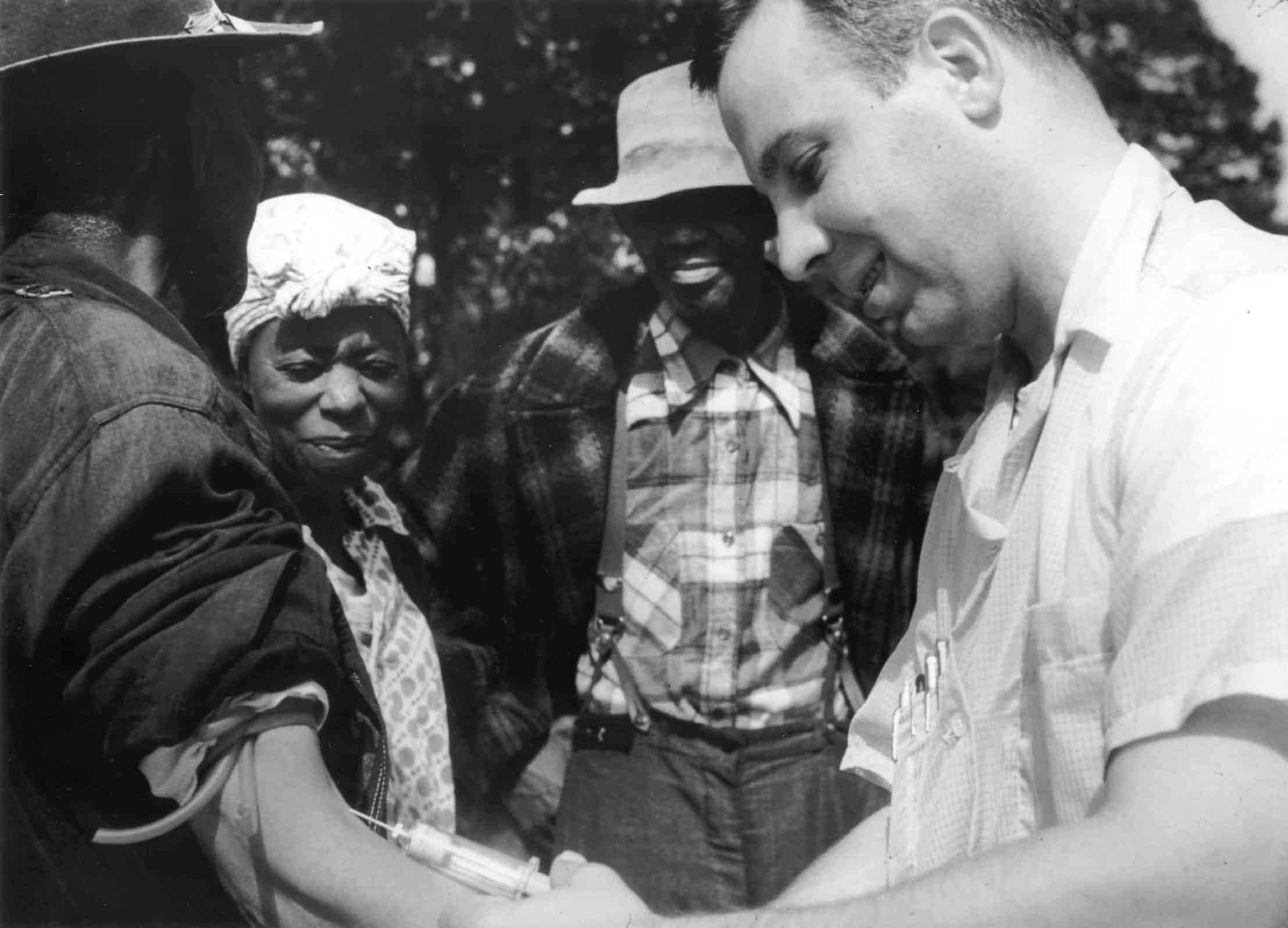 Man injecting a participant as part of the Tuskegee Syphilis Study