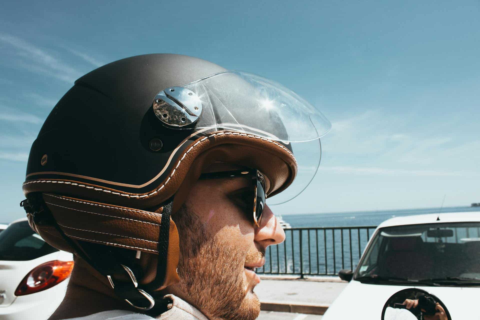 Man Wearing Black-and-brown Half-face Helmet and Black Sunglasses